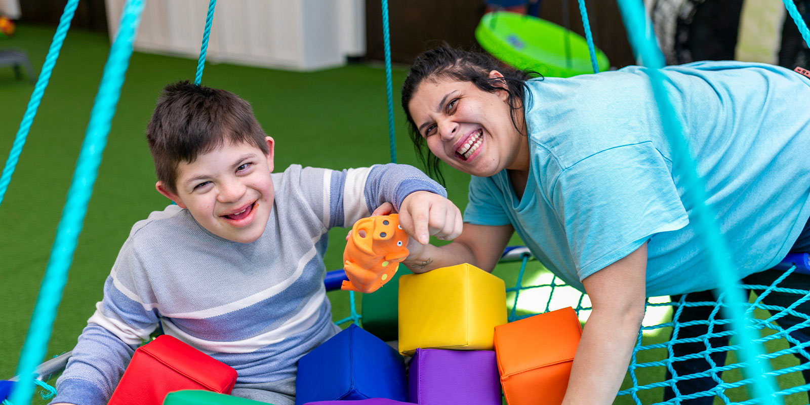 child and therapist playing at Pediatrics Plus